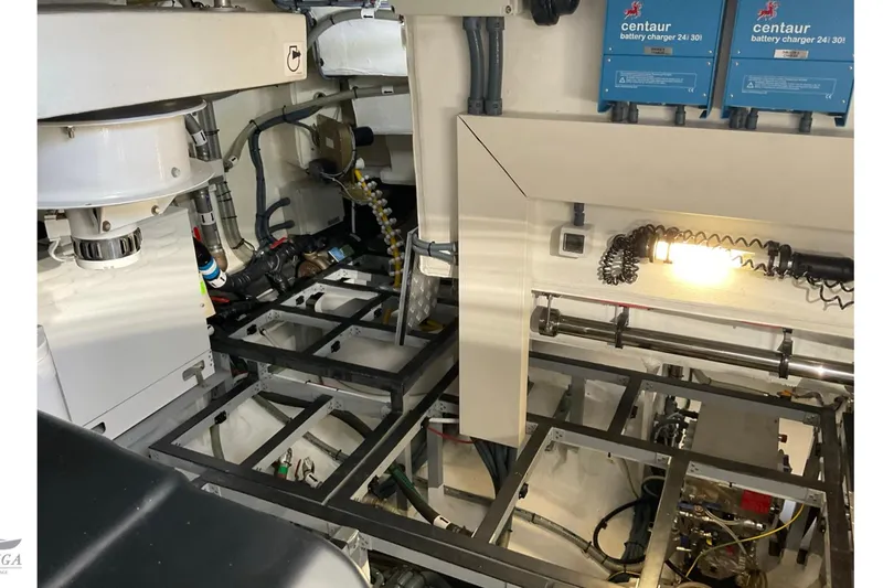  Yacht Photos Pics Engine room of 2022 Sirena 58 yacht with battery chargers and mechanical components.