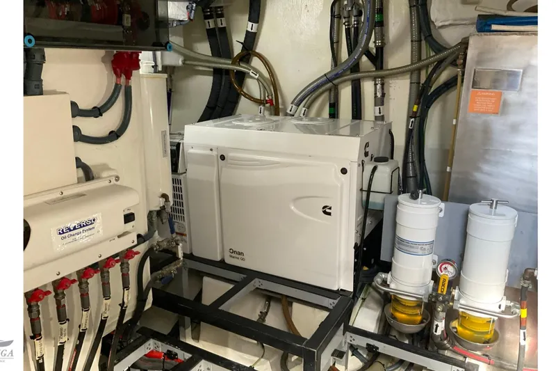 Yacht Photos Pics Engine room of 2022 Sirena 58 yacht featuring Onan generator and Reverso oil change system.