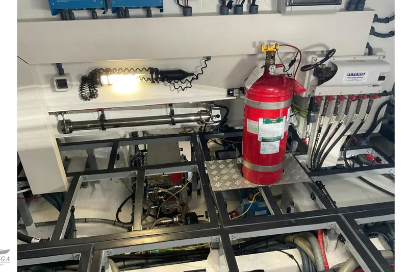  Yacht Photos Pics Engine room of 2022 Sirena 58 yacht with fire extinguisher and electrical systems.