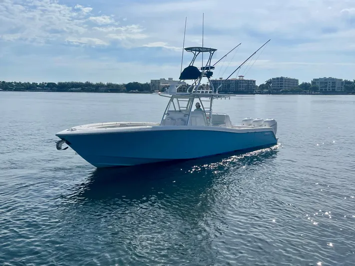 Saltwater Cowboy Yacht Photos Pics 2019 Invincible 39 Open Fisherman boat on calm water.