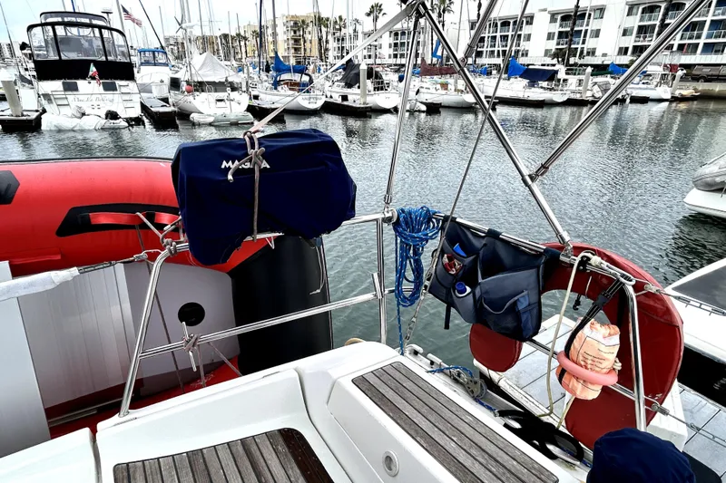 Notos Yacht Photos Pics Beneteau Oceanis 373 sailboat, 2005 model, docked in a marina with nautical equipment.