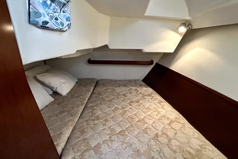 Notos Yacht Photos Pics Cozy cabin interior of 2005 Beneteau Oceanis 373 sailboat with comfortable bedding.