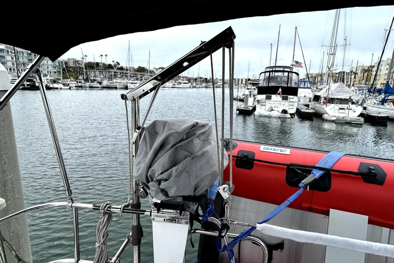 Notos Yacht Photos Pics Beneteau Oceanis 373 sailboat in marina, 2005 model, with docked boats in background.