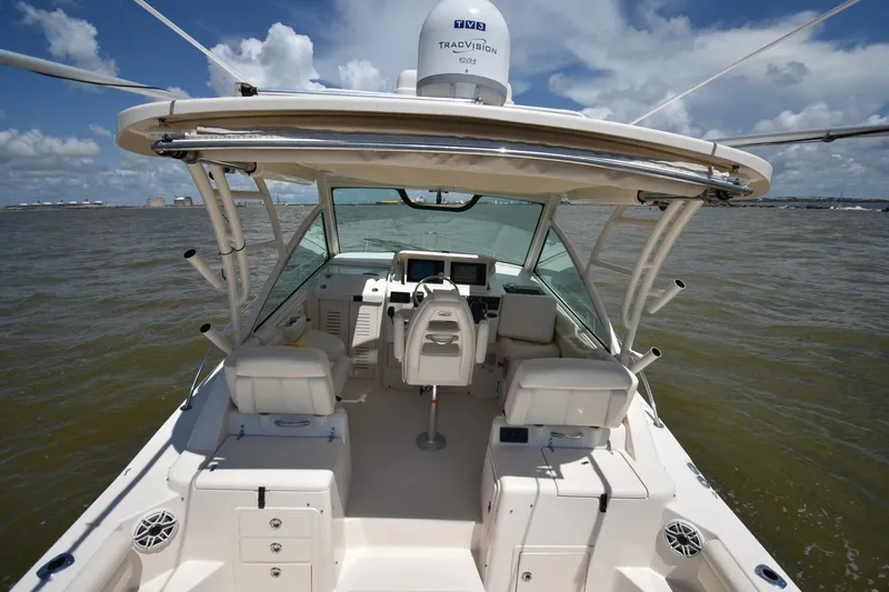 Policy Maker Yacht Photos Pics 2016 Grady-White Express 330 boat interior with helm, seating, and ocean view.
