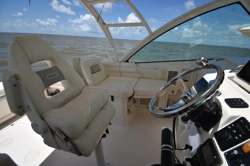 Policy Maker Yacht Photos Pics 2016 Grady-White Express 330 boat interior with helm and seating, ocean view.
