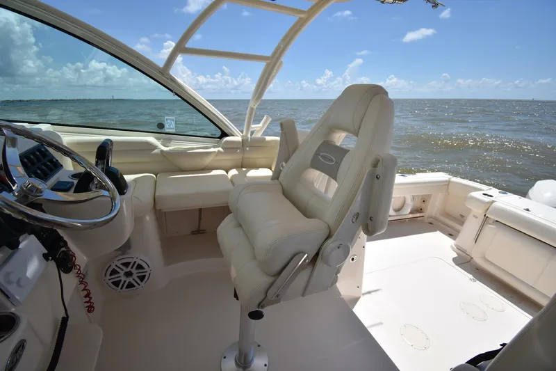 Policy Maker Yacht Photos Pics 2016 Grady-White Express 330 boat interior with helm seat and ocean view.