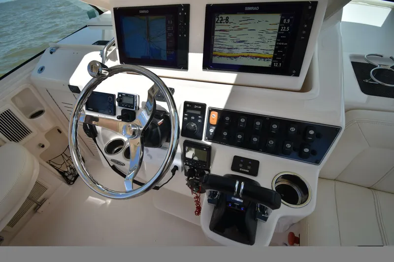 Policy Maker Yacht Photos Pics Helm of 2016 Grady-White Express 330 with navigation screens and controls.