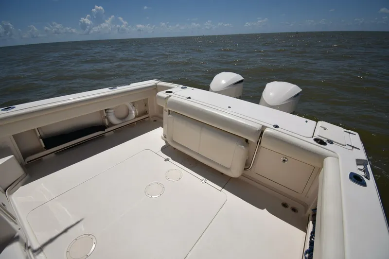 Policy Maker Yacht Photos Pics 2016 Grady-White Express 330 boat deck with twin engines on open water.
