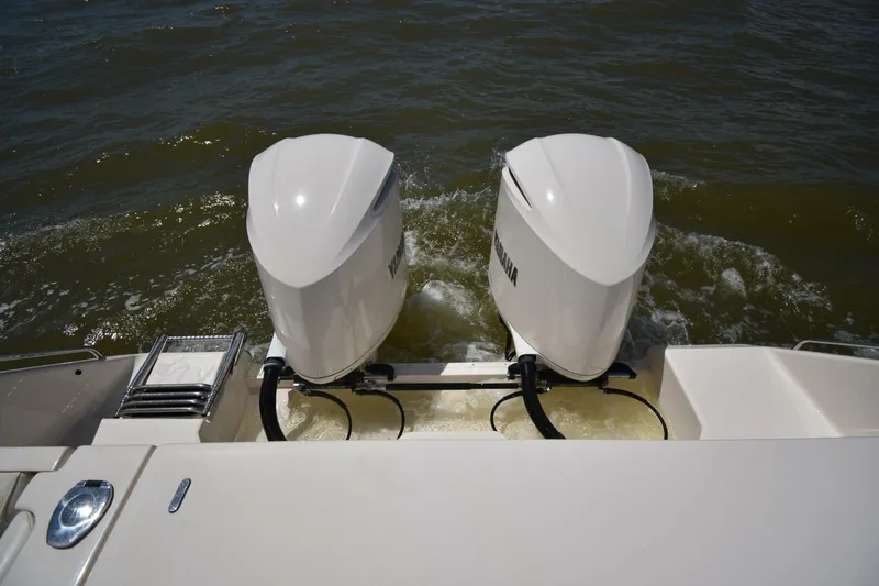 Policy Maker Yacht Photos Pics 2016 Grady-White Express 330 boat with dual outboard engines on water.