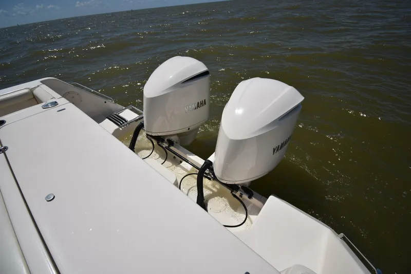 Policy Maker Yacht Photos Pics 2016 Grady-White Express 330 boat with twin Yamaha outboard engines on open water.