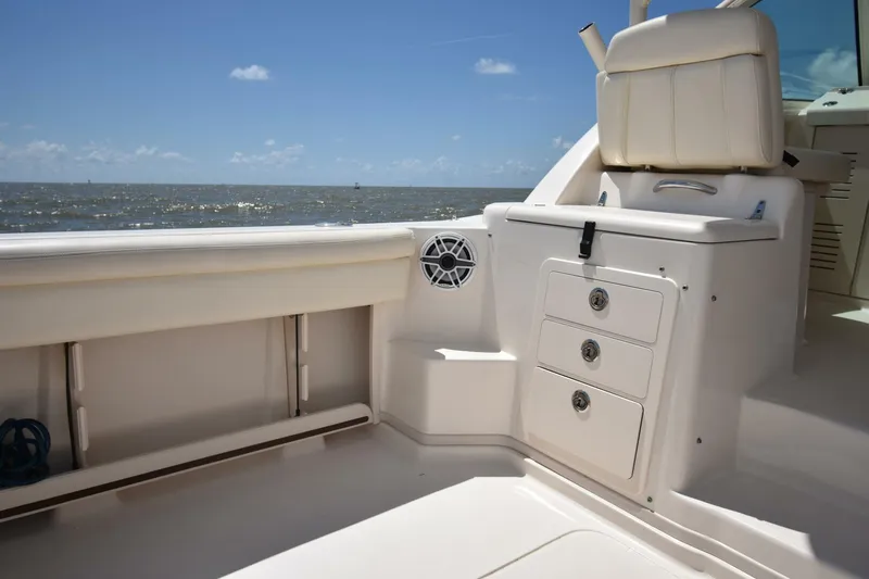 Policy Maker Yacht Photos Pics 2016 Grady-White Express 330 boat interior with seating and storage, ocean view.