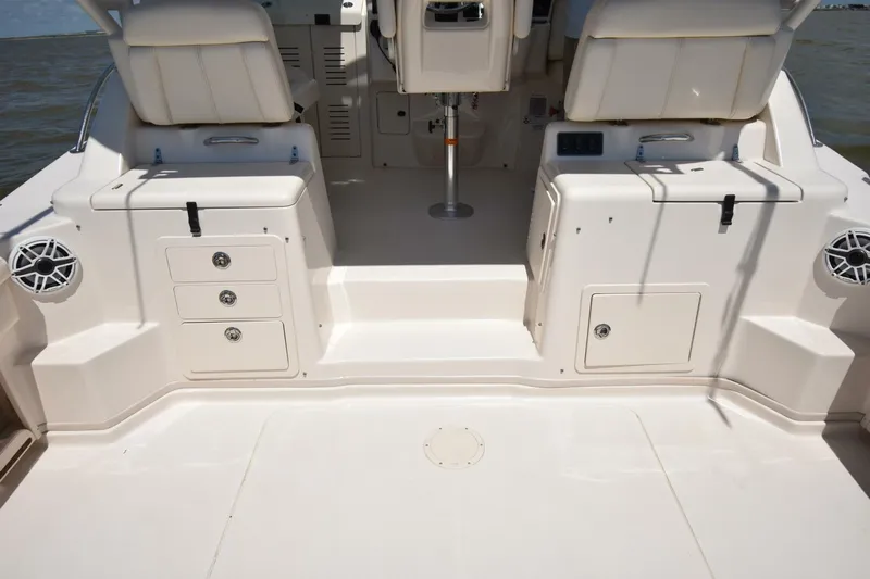 Policy Maker Yacht Photos Pics 2016 Grady-White Express 330 boat interior with seating and storage compartments.