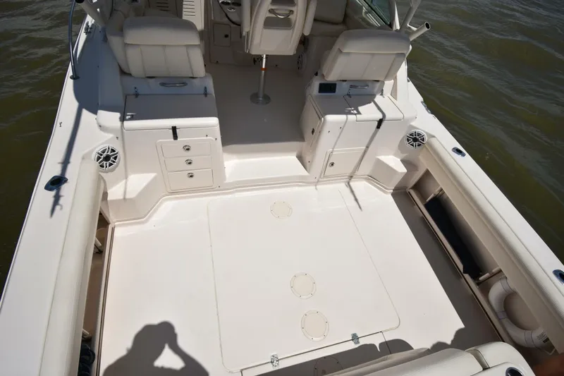Policy Maker Yacht Photos Pics 2016 Grady-White Express 330 boat interior with seating and storage compartments.