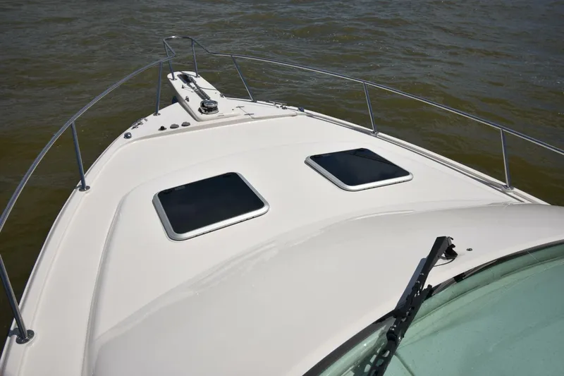Policy Maker Yacht Photos Pics 2016 Grady-White Express 330 boat deck with hatches, railing, and windshield wiper.