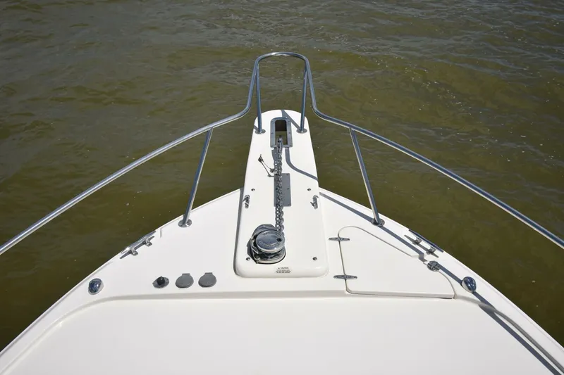 Policy Maker Yacht Photos Pics Bow of 2016 Grady-White Express 330 boat with anchor chain and railing.