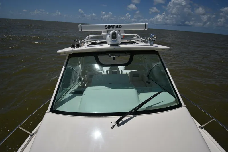 Policy Maker Yacht Photos Pics 2016 Grady-White Express 330 boat on open water under a clear sky.