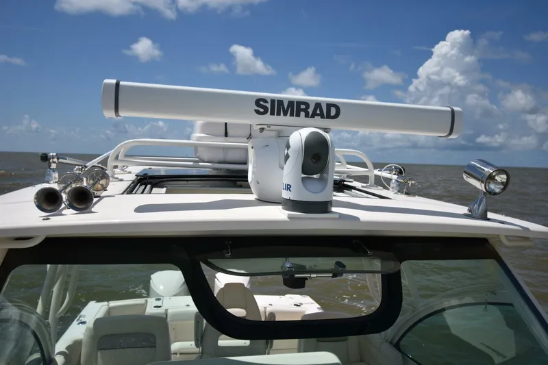 Policy Maker Yacht Photos Pics 2016 Grady-White Express 330 boat with Simrad radar and FLIR camera on open water.