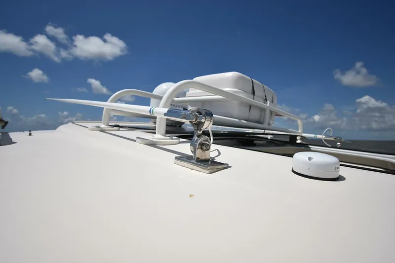 Policy Maker Yacht Photos Pics 2016 Grady-White Express 330 boat roof with antenna and equipment under blue sky.
