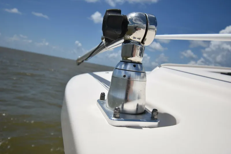 Policy Maker Yacht Photos Pics Close-up of a 2016 Grady-White Express 330 boat fitting against a blue sky.