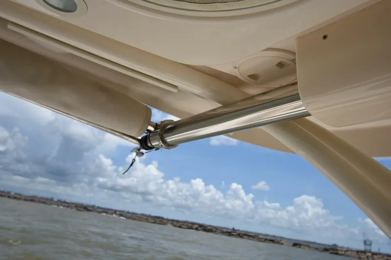 Policy Maker Yacht Photos Pics 2016 Grady-White Express 330 boat detail with ocean and sky background.