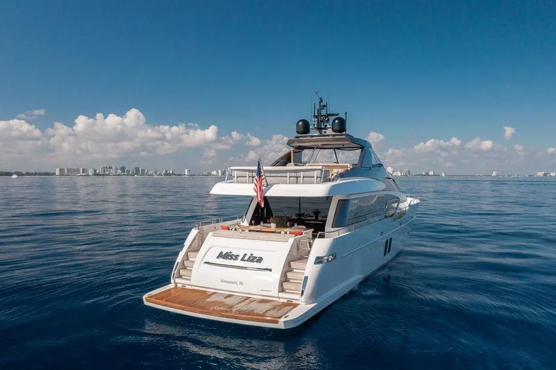 Sanlorenzo Sl86 Yacht Photos Pics Sanlorenzo SL86 2022 yacht on calm ocean with city skyline in background.