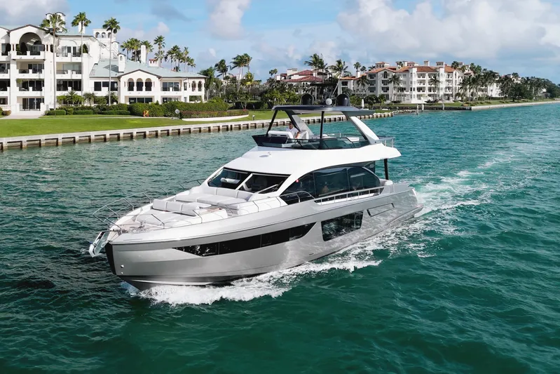  Yacht Photos Pics Luxury Azimut Fly 68 yacht cruising near waterfront homes, 2023 model.
