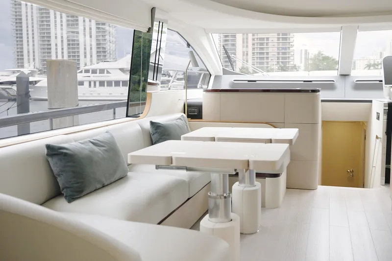  Yacht Photos Pics Luxurious interior of 2023 Azimut Fly 68 yacht with modern seating and large windows.