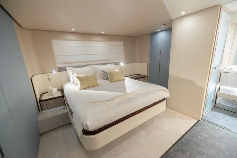  Yacht Photos Pics Luxurious bedroom interior of 2023 Azimut Fly 68 yacht, featuring modern design and elegant furnishings.