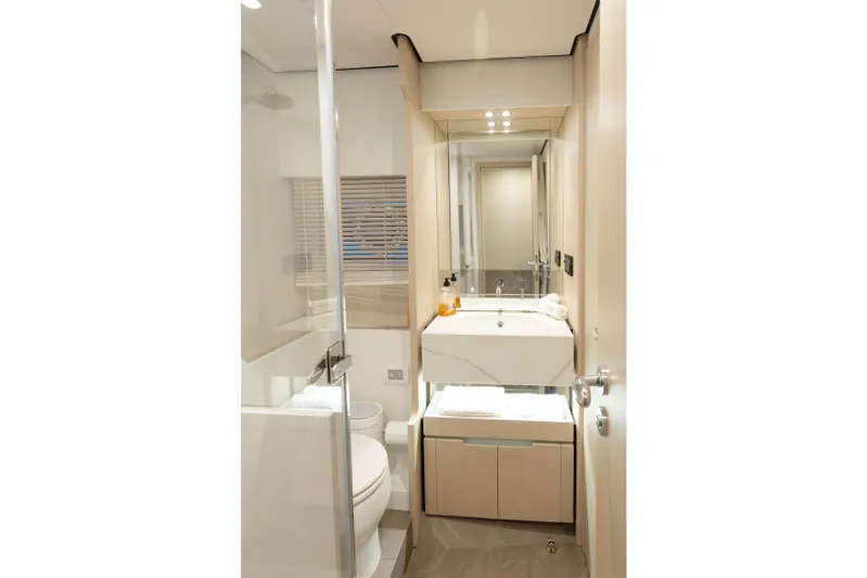  Yacht Photos Pics Luxurious bathroom in 2023 Azimut Fly 68 yacht, featuring modern fixtures and elegant design.