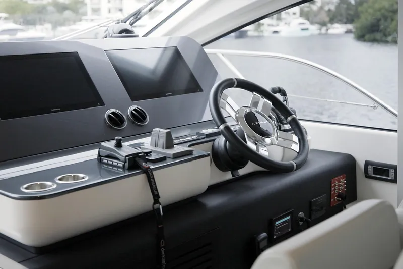  Yacht Photos Pics 2023 Azimut Fly 68 yacht helm with modern controls and dual screens.