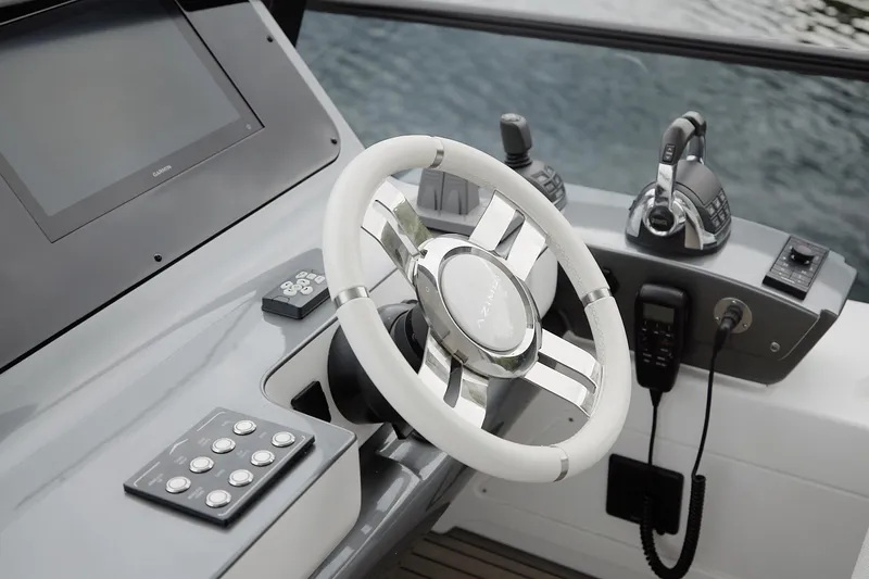  Yacht Photos Pics Steering wheel and controls of 2023 Azimut Fly 68 yacht cockpit.