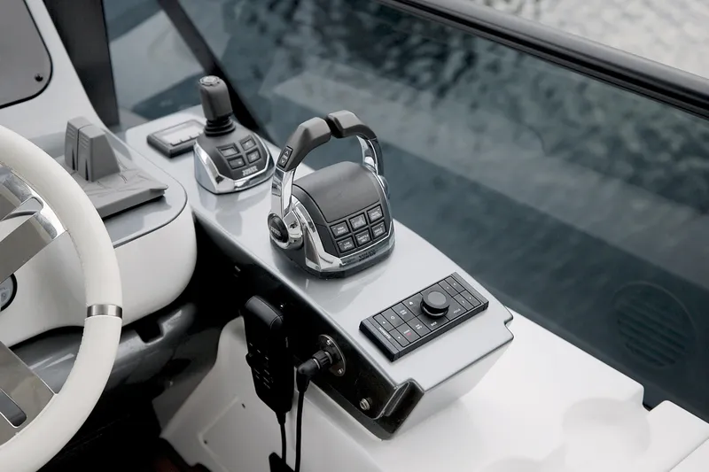  Yacht Photos Pics 2023 Azimut Fly 68 yacht control panel with modern steering and navigation equipment.