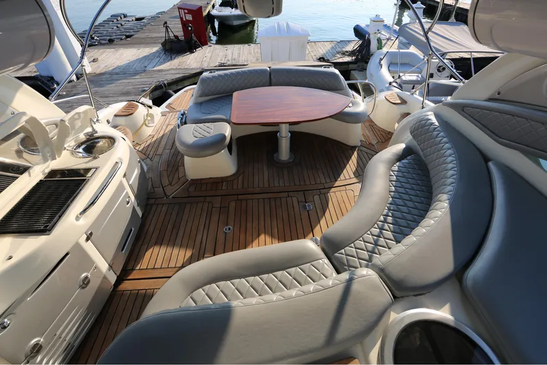 Yacht Photos Pics Luxurious 2008 Cranchi Mediterranee 43 yacht interior with elegant seating and wooden deck.