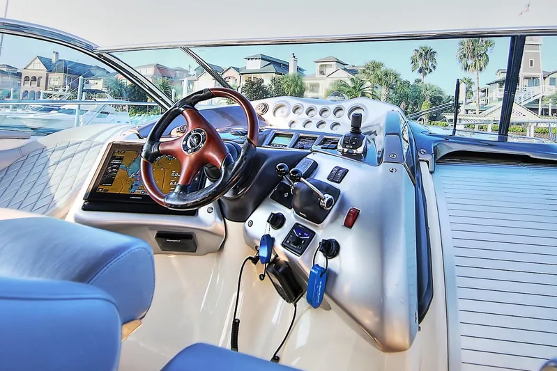  Yacht Photos Pics 2008 Cranchi Mediterranee 43 yacht cockpit with steering wheel and navigation system.