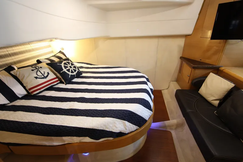  Yacht Photos Pics Luxurious cabin interior of 2008 Cranchi Mediterranee 43 yacht with nautical-themed bedding.