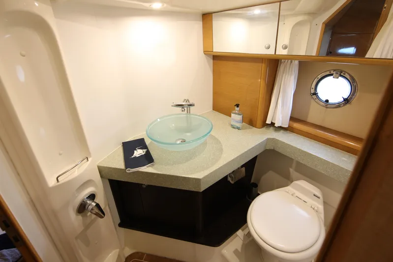  Yacht Photos Pics Luxurious bathroom in 2008 Cranchi Mediterranee 43 yacht with modern sink and porthole window.