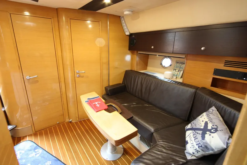  Yacht Photos Pics Luxurious interior of 2008 Cranchi Mediterranee 43 yacht with leather seating and wooden finishes.