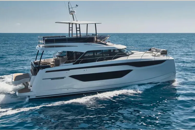  Yacht Photos Pics 2023 Prestige M48 yacht cruising on open sea, showcasing sleek design and luxury features.