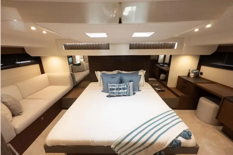  Yacht Photos Pics Luxurious 2023 Prestige M48 yacht bedroom with elegant decor and modern furnishings.