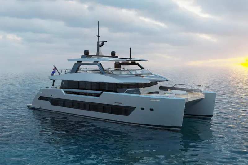  Yacht Photos Pics Futuristic 2027 Silver Yachts SC24M catamaran on serene ocean at sunset.