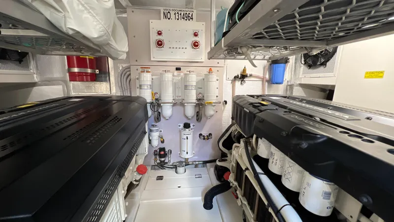 Trigal Yacht Photos Pics Engine room of a 2021 Maritimo X60 yacht, featuring dual engines and control systems.