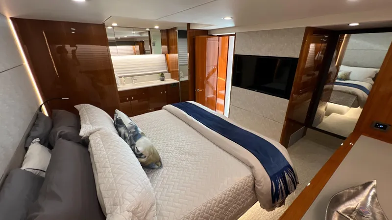Trigal Yacht Photos Pics Luxurious bedroom interior of 2021 Maritimo X60 yacht with modern design and elegant furnishings.