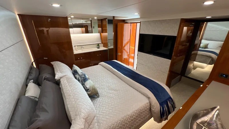 Trigal Yacht Photos Pics Luxurious bedroom interior of 2021 Maritimo X60 yacht with modern design and elegant furnishings.