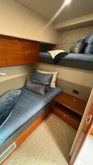 Trigal Yacht Photos Pics 2021 Maritimo X60 yacht cabin with twin beds and wooden storage.