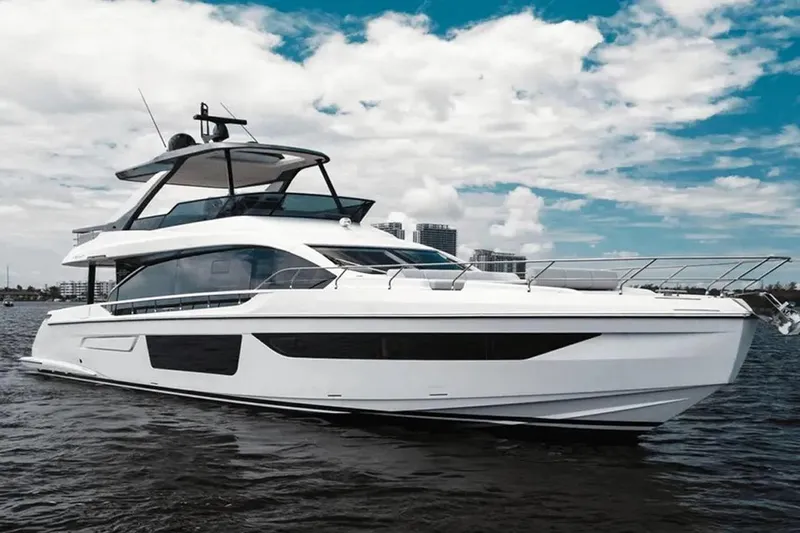  Yacht Photos Pics 2025 Azimut Fly 68 yacht on water under a partly cloudy sky.