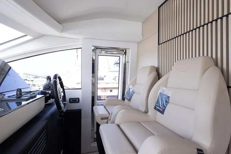  Yacht Photos Pics Luxurious interior of 2025 Azimut Fly 68 yacht with plush seating and modern helm.