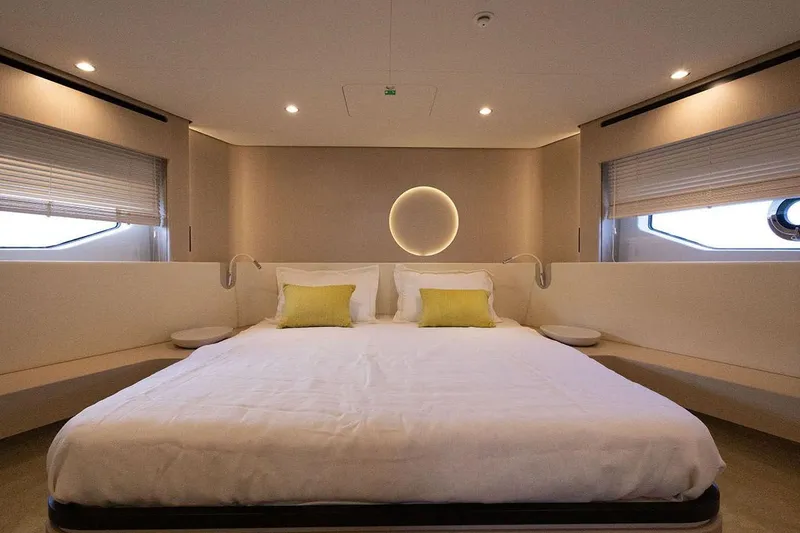  Yacht Photos Pics Luxurious bedroom interior of 2025 Azimut Fly 68 yacht with modern design and ambient lighting.