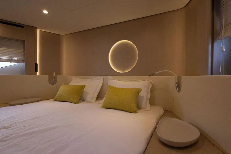  Yacht Photos Pics Luxurious bedroom interior of 2025 Azimut Fly 68 yacht with modern lighting and decor.