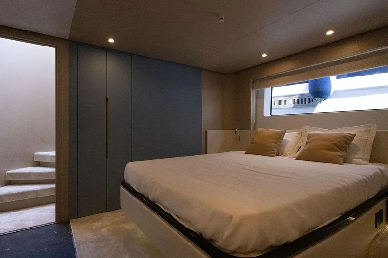  Yacht Photos Pics Luxurious bedroom interior of 2025 Azimut Fly 68 yacht with modern design.
