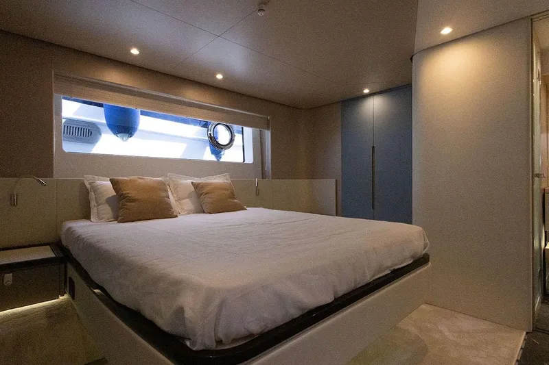  Yacht Photos Pics Luxurious bedroom interior of 2025 Azimut Fly 68 yacht with modern design and cozy ambiance.